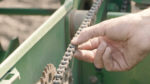 Precision planting checking chains