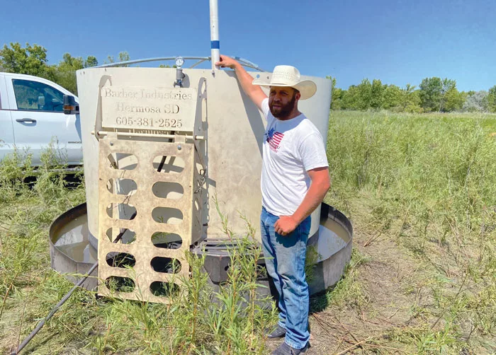 Cody-Kologi-with-a-portable-water-tank.jpg